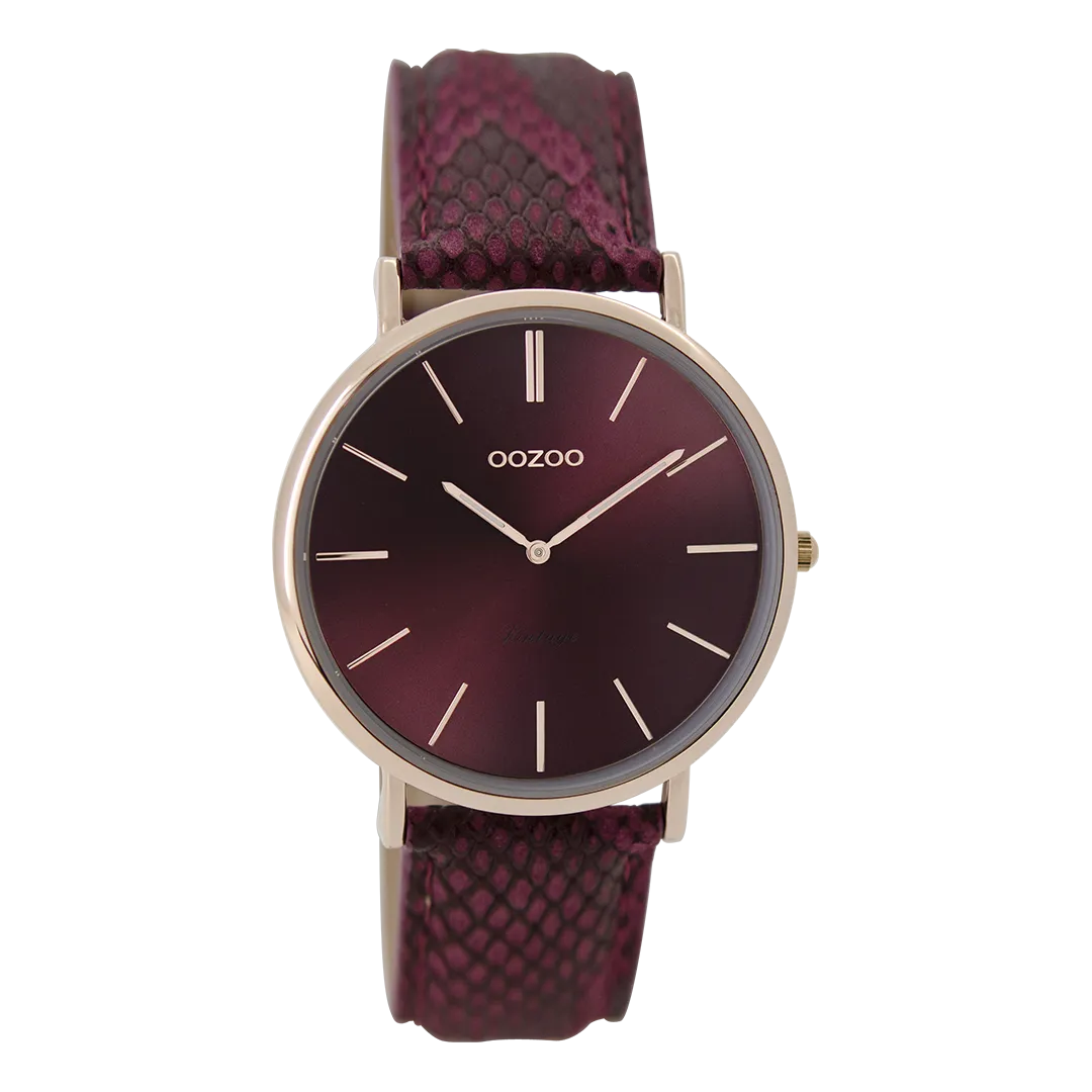 Rose gold coloured  watch with burgundy leather strap